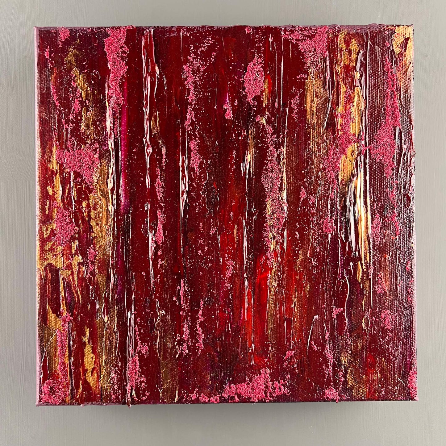 vivi & vela gemstone collection 'garnet' artwork in deep crimson hues.